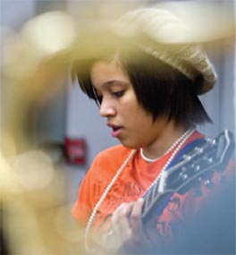 Student playing guitar