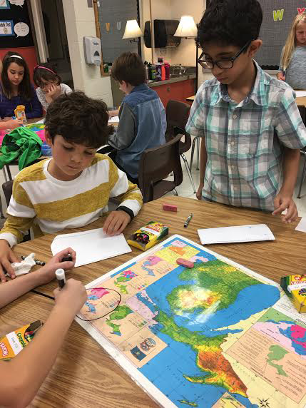 Students working with map 
